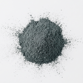 Pile of dark black powder on a white background